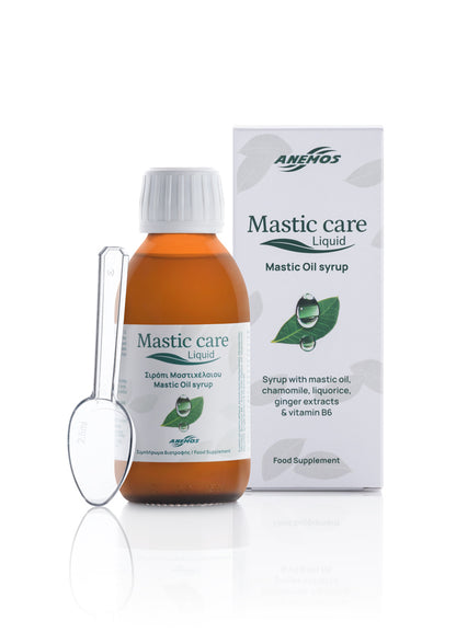 Amenos Mastic Care Liquid Mastic Oil Syrup bottle with a white cap, shown next to a clear plastic measuring spoon and its white retail box on a white background.